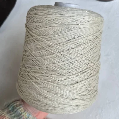 Бобина Kachinelli Merino (85% меринос, 4% хлопок, 11% пайетки), 310 м. (2717, Стеклянный пляж)