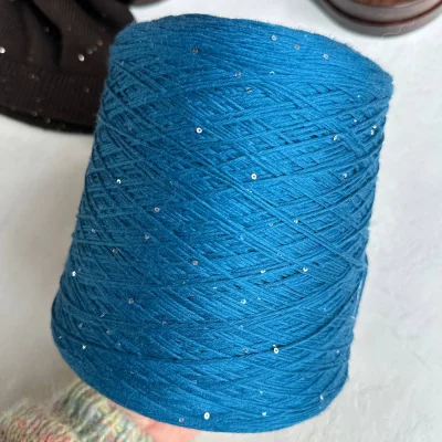 Бобина Kachinelli Merino (85% меринос, 4% хлопок, 11% пайетки), 310 м. (1101, Петроль)
